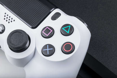 Sankt-Petersburg, Russia, May 20, 2017: Sony PlayStation 4 game console with a joystick dualshock 4...