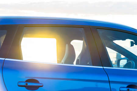 Sunset through the window of a modern car, car exterior detailsの写真素材