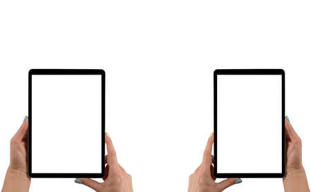 Beautiful Woman hands holding tablet computer with isolated white screen. Business workplace with copy space. Empty space for text. Isolated screen for mock up. Left and right handの写真素材