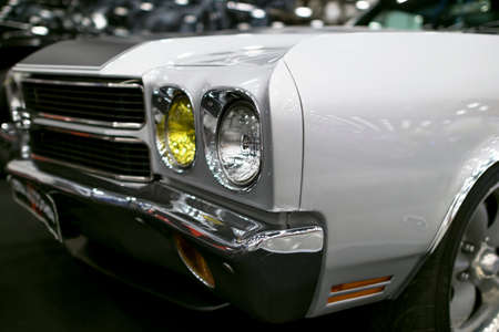 Front view of a old retro car. Car exterior details. Headlight of a retro car. The front lights of the carのeditorial素材