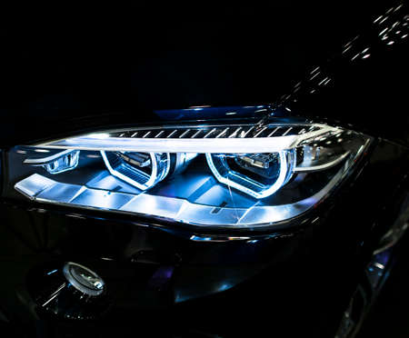 Sankt-Petersburg, Russia, July 21, 2017: BMW X6M 2017. Headlight of a modern sport car. Front view...