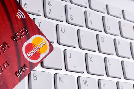 Sankt-Petersburg, Russia, July 09, 2017: MasterCard credit cards on computer keyboard in office. Photo taken in Sankt-Petersburg, Russia, July 09, 2017のeditorial素材