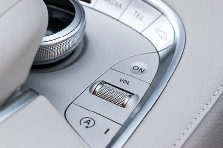 Media and navigation control buttons of a Modern car. Car interior details. White leather interior of the luxury modern car. Modern car interiorの写真素材