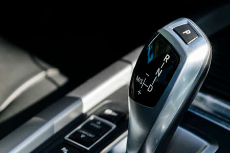 Automatic gear stick of a modern car car interior detailsの写真素材