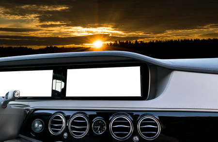 White Screen system display for GPS Navigation and Multimedia as automotive technology in car. white copy space of touch screen. Modern car dashboard empty space for text. Blank empty white screen. Outdoor concept over the sunset.の写真素材
