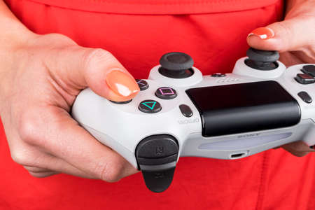 Sankt-Petersburg, Russia, September 24, 2017: Sony PlayStation 4 dualshock game controller in gamers...