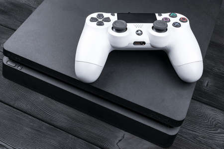 Sankt-Petersburg, Russia, September 24, 2017: Sony PlayStation 4 Slim 1Tb revision and dualshock...