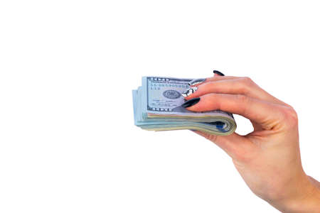 Hand with money isolated on white background. US Dollars in hand. Handful of money. Business woman...