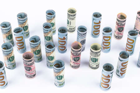 Dollar. Dollar banknotes roll in other positions. American US currency on white board. American...