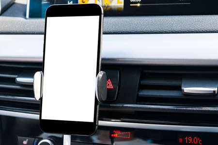 Smartphone in a car use for Navigate or GPS. Driving a car with Smartphone in holder. Mobile phone...