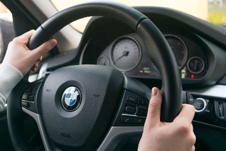Sankt-Petersburg, Russia, November 16, 2017: Woman's hands on a steering wheel driving BMW X5 F15....