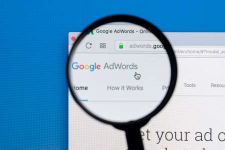 Sankt-Petersburg Russia December 7, 2017: Google Adwords homepage website on Apple iMac monitor screen under a magnifying glass. Google AdWords is online advertising service.のeditorial素材