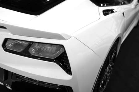 The back view of a yellow luxury sport car. Exhaust system. Modern Sport Car exterior details. Black and white.のeditorial素材