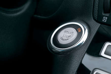 Car dashboard with focus on engine start stop button, Modern car interior details. startstop