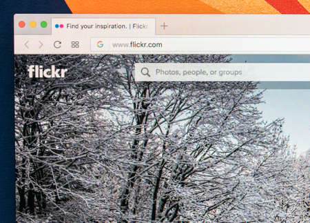 Sankt-Petersburg Russia ,January 11, 2018: Apple iMac with Flickr homepage on monitor screen. Flickr is the video hosting network website. Homepage of Flickr.com on PC computer.のeditorial素材