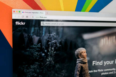 Sankt-Petersburg Russia ,January 11, 2018: Apple iMac with Flickr homepage on monitor screen. Flickr is the video hosting network website. Homepage of Flickr.com on PC computer.のeditorial素材