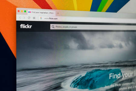 Sankt-Petersburg Russia, January 11, 2018: Apple iMac with Flickr homepage on monitor screen. Flickr is the video hosting network website. Homepage of Flickr.com on PC computer.のeditorial素材