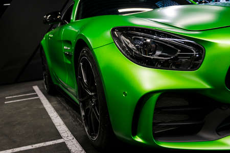 Sankt-Petersburg, Russia, January 12, 2018 : Green Mercedes-Benz AMG GTR 2018 V8 Biturbo exterior details, Headlight. Front view. Car exterior detailsのeditorial素材