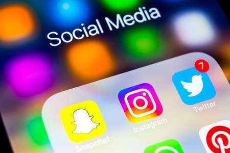 Sankt-Petersburg, Russia, March 6, 2018: Apple iPhone X with icons of social media facebook, instagram, twitter, snapchat application on screen. Social media icons. Social media networkのeditorial素材