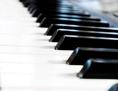Side view of piano keys. Close-up of piano keys. Close frontal view. Piano keyboard with selective...