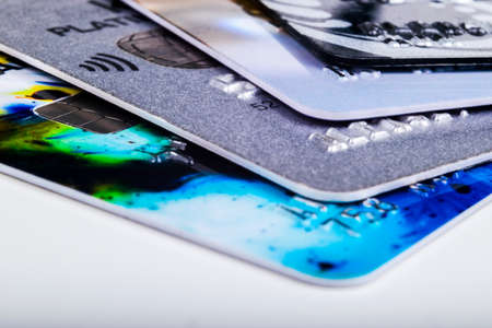 Credit card. Macro shot. Close Up Credit card payment. Background. Macro shot of chip and pin credit card. Credit and finance concept. Stack of credit cards. Debit and Credit cards. Shallow depth of fieldの写真素材