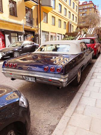 Stockholm, Sweden, April 21 2018: Back view of old retro classic car Chevrolet Impala SS 1965 on city street. Car detailingのeditorial素材