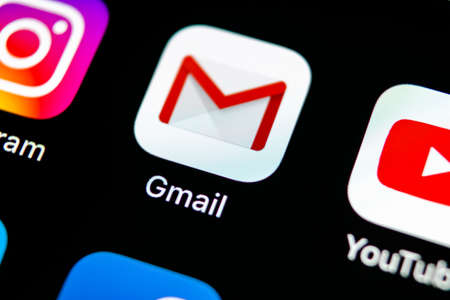 Sankt-Petersburg, Russia, May 10, 2018: Google Gmail application icon on Apple iPhone X smartphone screen close-up. Gmail app icon. Gmail is  popular Internet online e-mail. Social media iconのeditorial素材