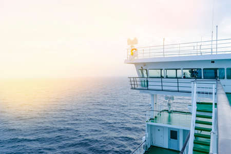 Cruise ship white cabin with big windows. Wing of running bridge of cruise liner. White cruise ship...