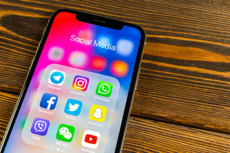 Sankt-Petersburg, Russia, May 30 2018: Apple iPhone X with icons of social media facebook, instagram, twitter, snapchat application on screen. Social media icons. Social network. Social mediaのeditorial素材