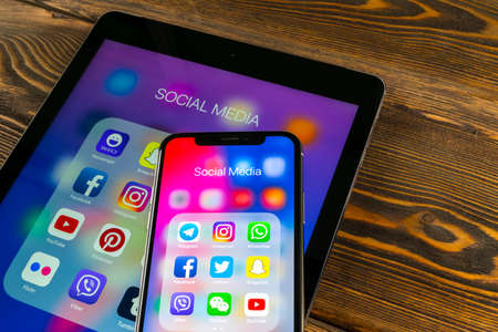 Sankt-Petersburg, Russia, May 30 2018: Apple iPad and iPhone X with icons of social media facebook, instagram, twitter, snapchat application on screen. Social media icons. Social network. Social mediaのeditorial素材