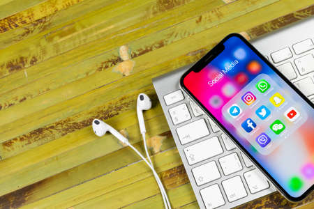 Sankt-Petersburg, Russia, June 2, 2018: Apple iPhone X with icons of social media facebook, instagram, twitter, snapchat application on screen. Social media icons. Social network. Social mediaのeditorial素材