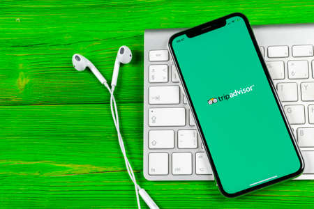 Sankt-Petersburg, Russia, June 2 2018: Tripadvisor application icon on Apple iPhone X screen close-up. Tripadvisor.com app icon. Social media network. Social media appのeditorial素材