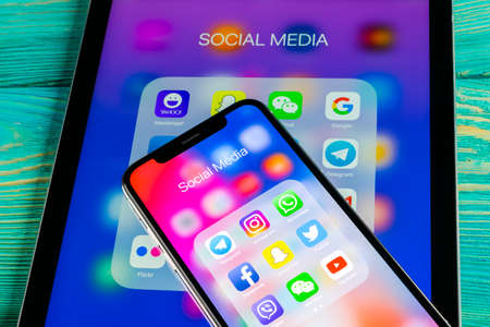 Sankt-Petersburg, Russia June 8, 2018: Apple iPhone X and iPad with icons of social media facebook, instagram, twitter, snapchat application on screen. Social media icons. Social network. Social mediaのeditorial素材