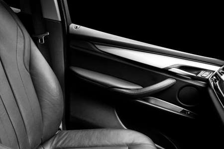 Modern Luxury car inside. Interior of prestige modern car. Comfortable leather black seats. Black...
