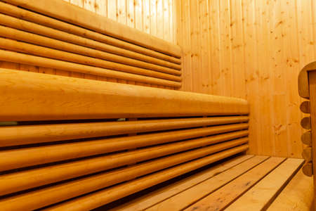 Interior of Finnish sauna, classic wooden sauna, Finnish bathroom. Wooden sauna cabin. Wooden room. Sauna steam.の写真素材