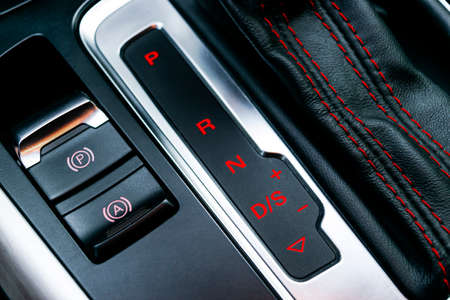 Automatic gear stick of a modern car. Maodern car interior details. Close up view. Car detailing....