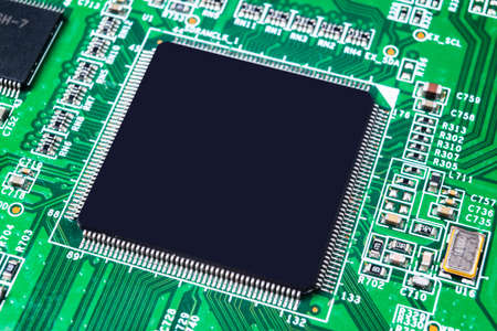 Macro shot of a Circuitboard with resistors microchips and electronic components. Computer hardware...