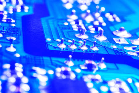 Macro shot of a Circuitboard with resistors microchips and electronic components. Computer hardware...