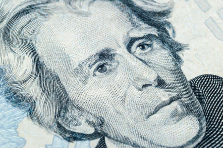 Close up view Portrait of Andrew Jackson on the one twenty dollar bill. Background of the money. 20 dollar bill with Andrew Jackson eyes macro shot. Money background. Face portraitのeditorial素材