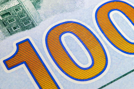 Macro shot image of the corner of a 100 dollar bill banknotes. Concept of financial success....