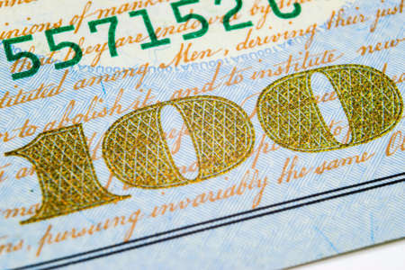 Macro shot image of the corner of a 100 dollar bill banknotes. Concept of financial success....