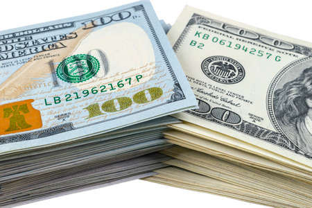 Stack of one hundred dollar bills isolated on white background. Stack of cash money in hundred...
