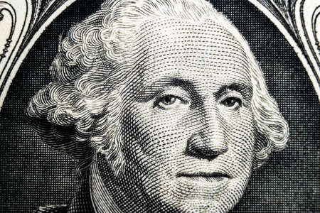 US president George Washington face portrait on the USA one dollar note. Macro shot. Background of the money. George Washington eyes macro shot.のeditorial素材