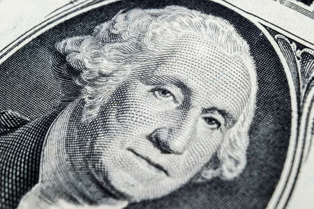 US president George Washington face portrait on the USA one dollar note. Macro shot. Background of the money. George Washington eyes macro shot.のeditorial素材