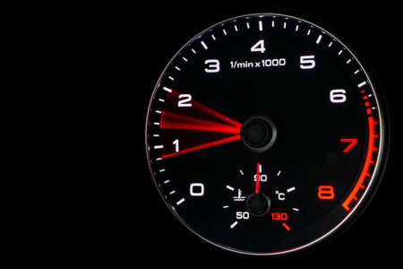 Close up shot of a speedometer in a car. Car dashboard. Dashboard details with indication lamps.Car...