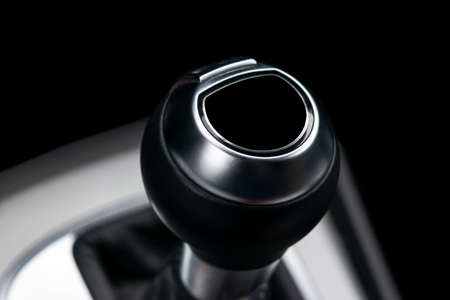 Close up view of a gear lever shift. Manual gearbox. Car interior details. Car transmission. Soft...