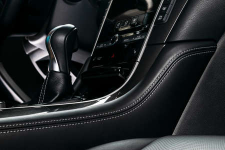 Modern Luxury car inside. Interior of prestige modern car. Comfortable leather seats with stitching....