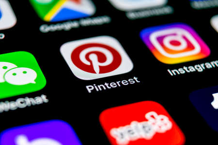 Sankt-Petersburg, Russia, September 30, 2018: Pinterest application icon on Apple iPhone X smartphone screen. Pinterest app icon. Pinterest is the  popular Internet social network. Social media iconのeditorial素材