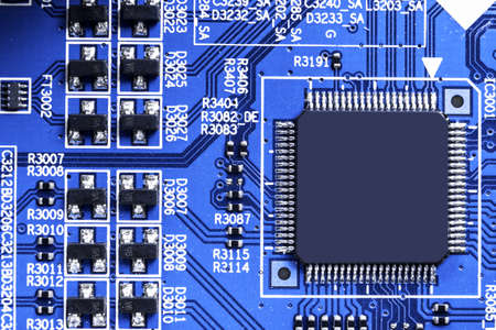 Macro shot of a Circuitboard with resistors microchips and electronic components. Computer hardware...