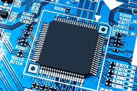 Macro shot of a Circuitboard with resistors microchips and electronic components. Computer hardware...
